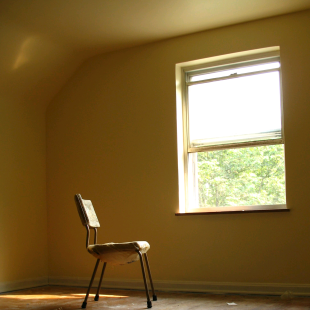 Lonely chair sat in an empty room