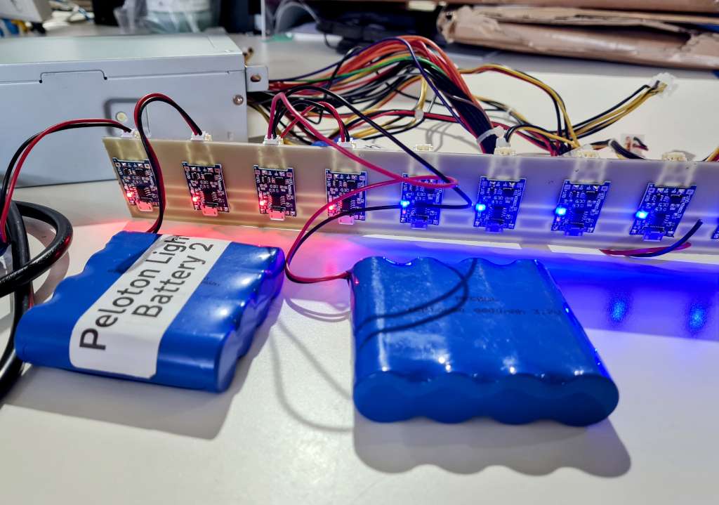 Ten 4056 charging circuits connected by a milled copper board recharging batteries