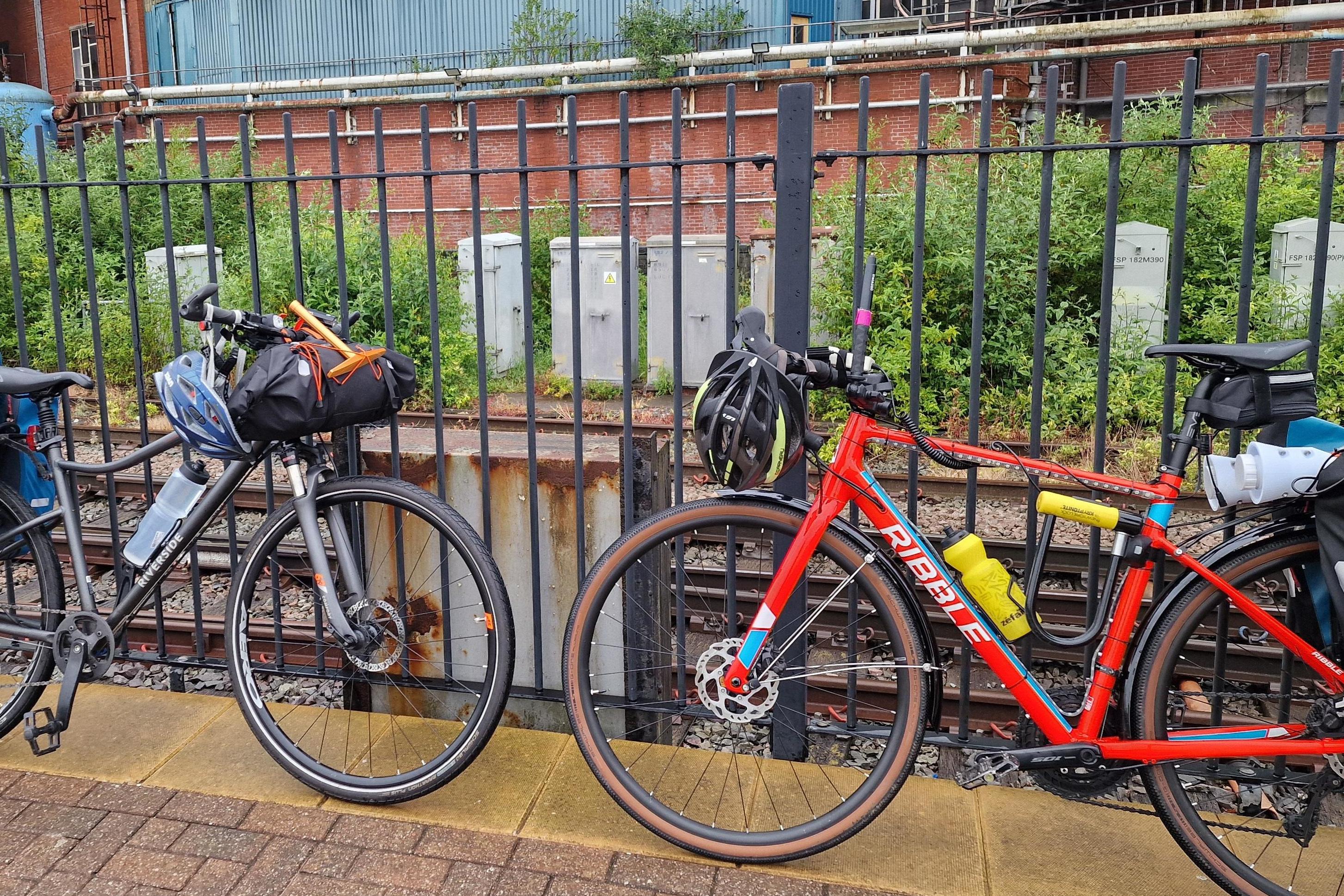 Two bikes propped up against the fence at Warrington Bank Quay. If we had known then that the train we were waiting for would not get beyond Preston it could have been a very different day.