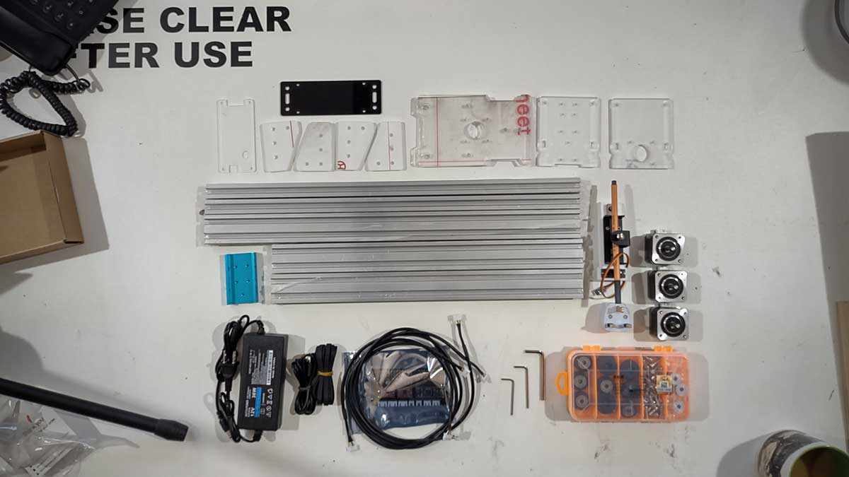 The separated components of a CNC plotter, fresh out of the box.