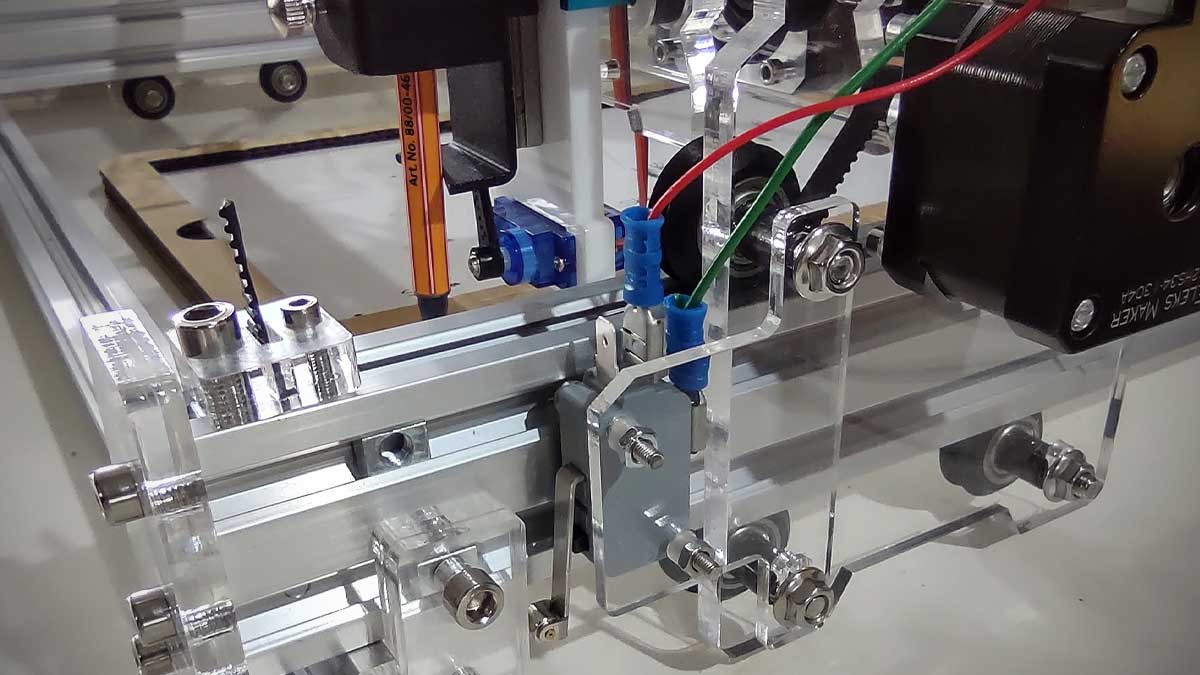 Close up of a limit switch fitted to the aluminium frame of a CNC plotter.